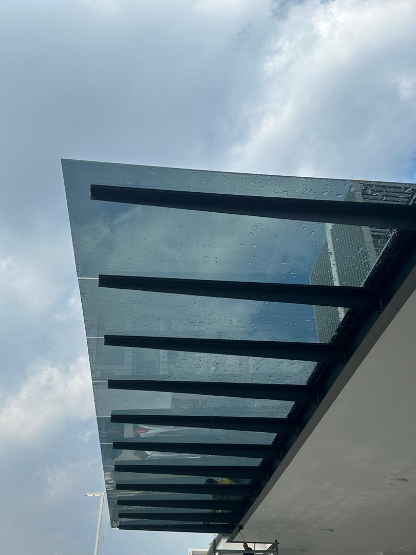 Transform Your Space with Modern Elegance: T-Beam Glass Awnings by Awnings Malaysia